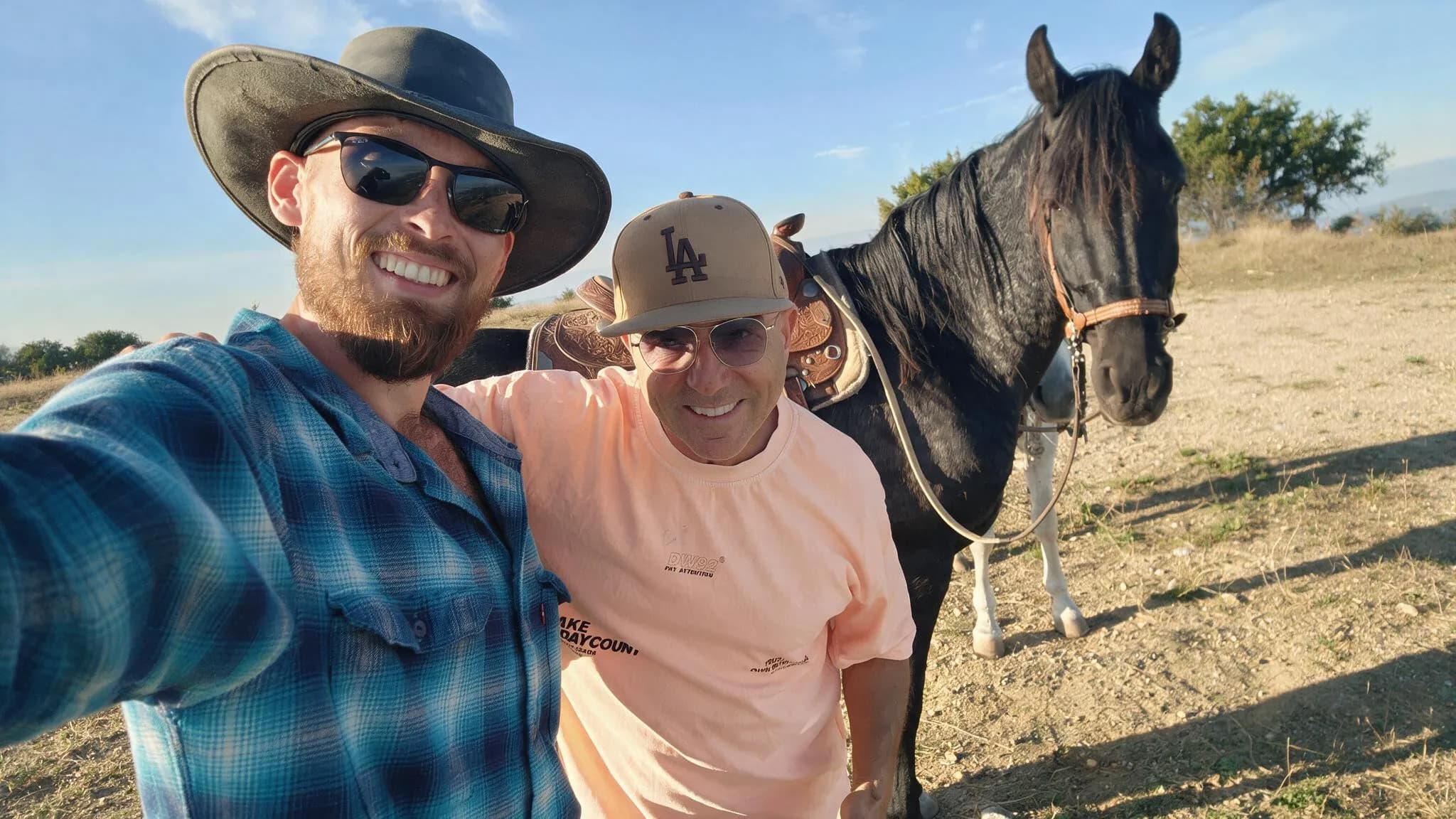 Two of the foundation's team standing together with a horse